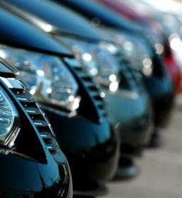 A fleet of professional cars all parked in a row