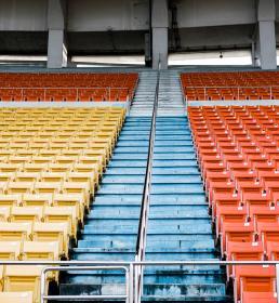 A view from the pitch of rows of empty stadium seats